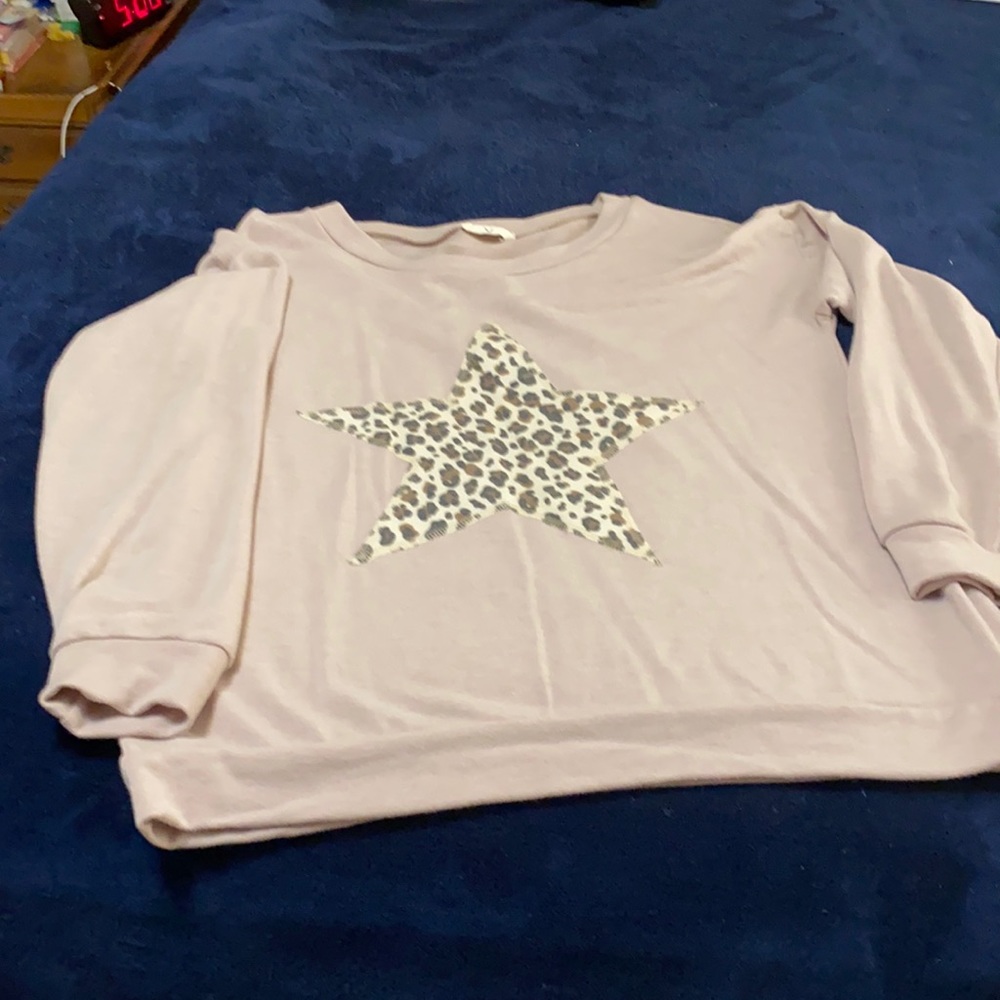 Long sleeve top with star on front.